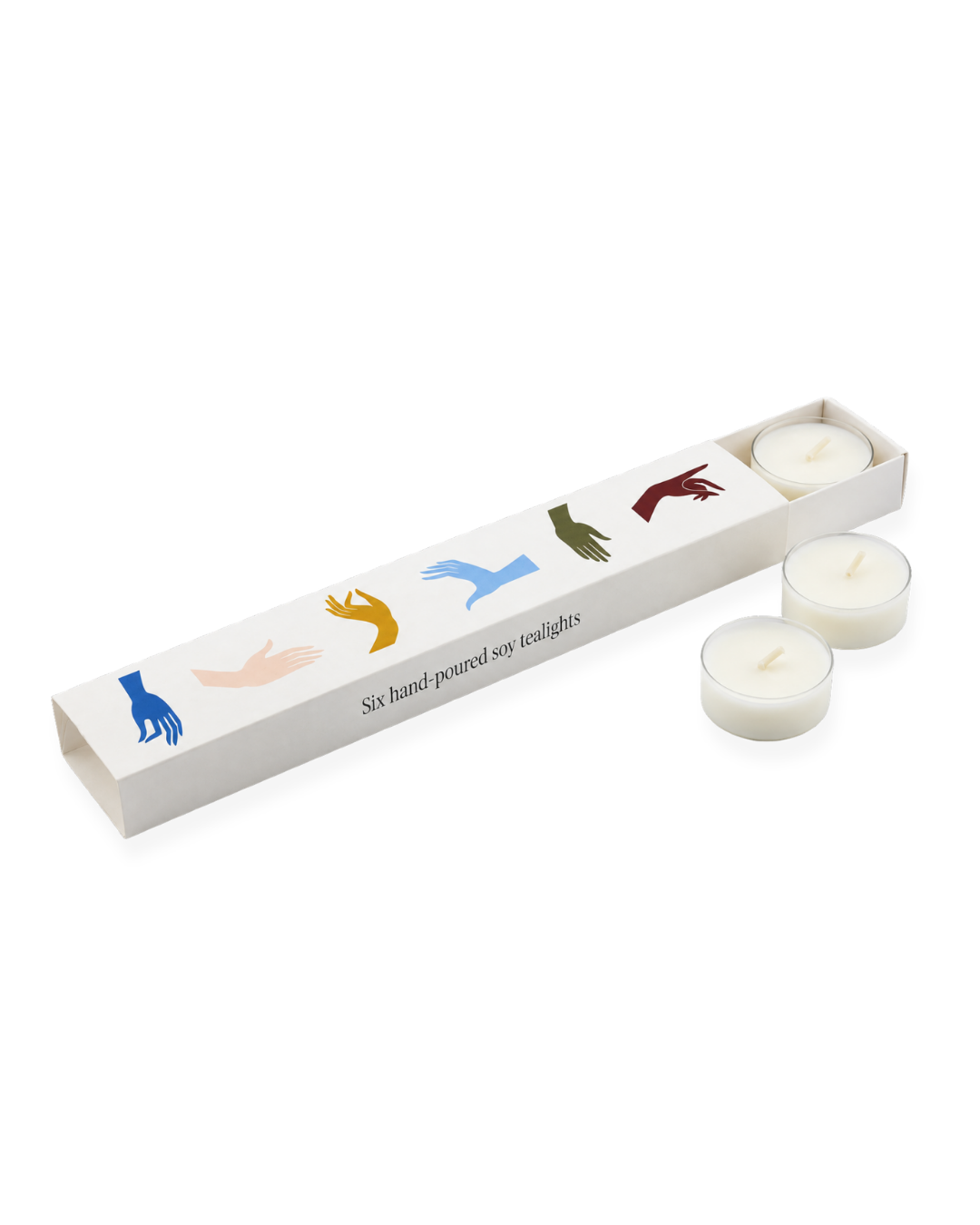 A gift set of six hand-poured tea light candles in a white cardboard tray with illustrations of six hands in different colors and the text 'Six hand poured six tea lights'. Two candles are shown standing outside the tray, and four are inside. Issy Granger 