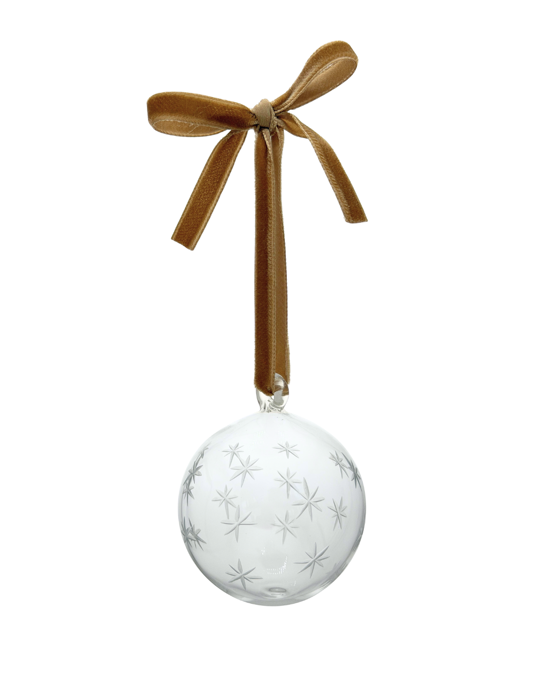 A clear glass Christmas ornament bauble with etched stars, hanging from a gold velvet ribbon tied in a bow. christmas tree decoration 