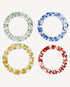 Set of four handmade glass napkin rings in amber, blue, red and green