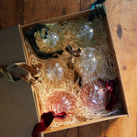 Issy Granger Green Red Gold Swirl Glass Christmas Baubles. Glass Christmas Ornaments. Glass Christmas Tree decorations. Velvet Ribbon. Set of six decorations.