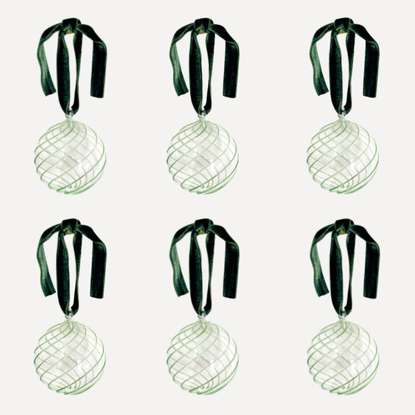 Set of six handblown glass Christmas baubles with green swirl design and velvet ribbon